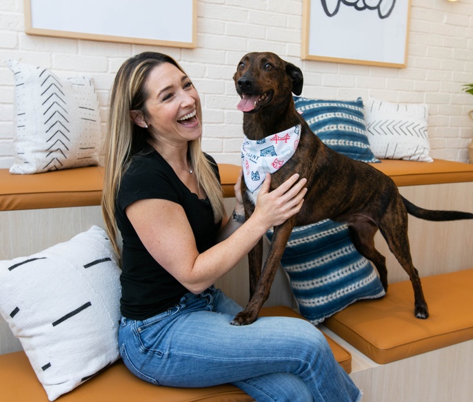 Vet with pet in lobby